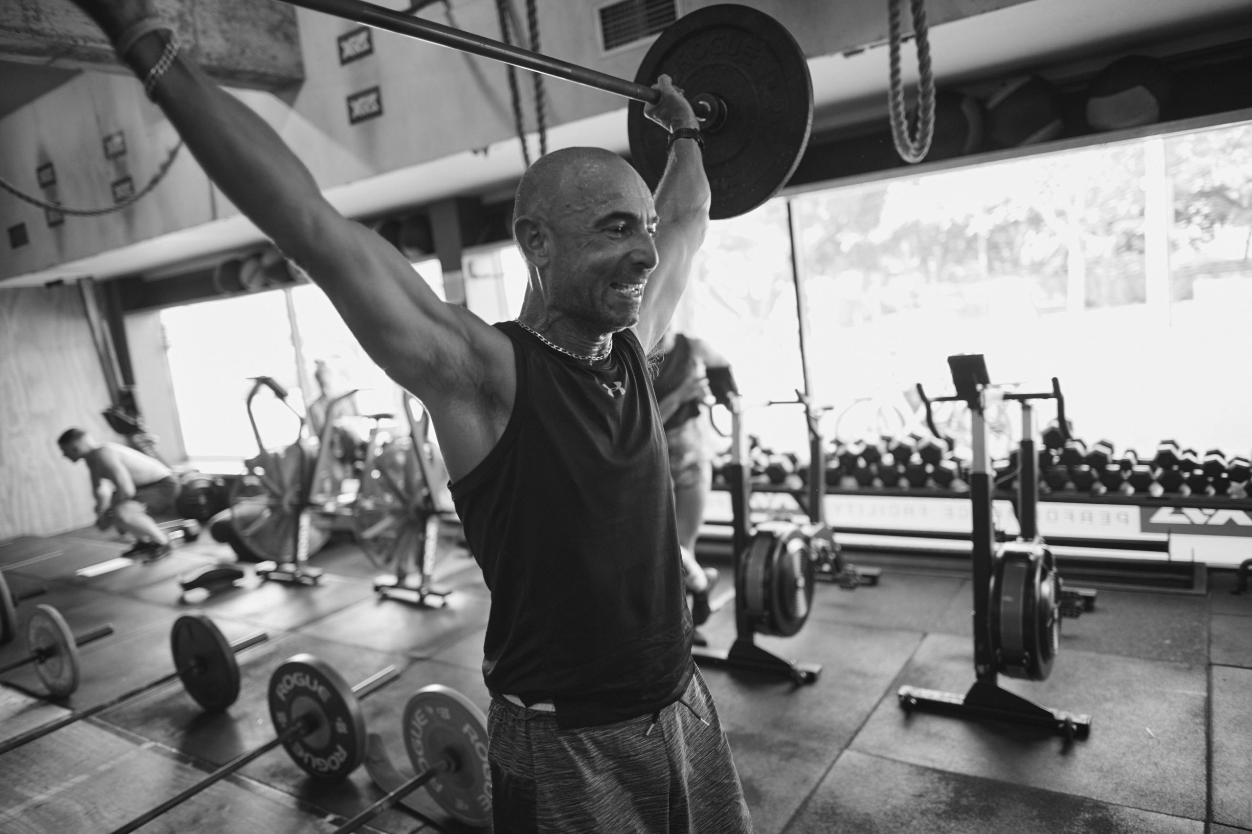 CrossFit Bondi - Progress Tracking & Nutrition Coaching CrossFit Bondi member focused on barbell movement during personal training session in Sydney