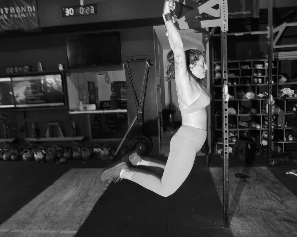 Member on the pull-up rig at CrossFit Bondi